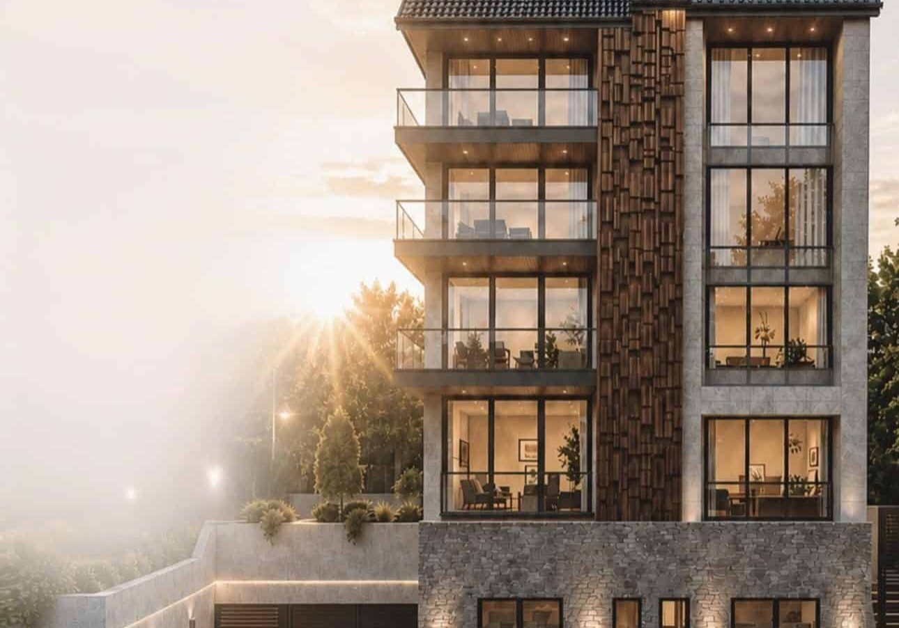 Modern multi-story residential building with balconies and large windows at sunset.